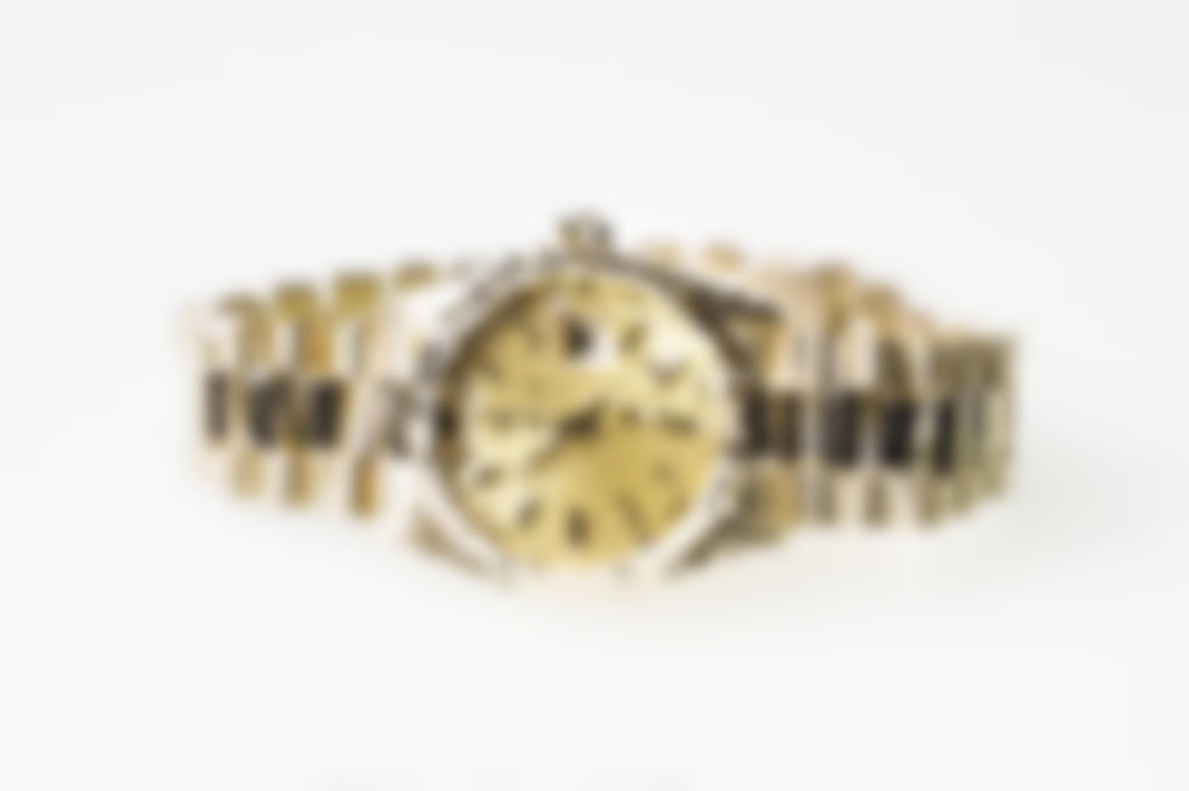 Pre-owned men’s Rolex Day-Date in yellow gold.