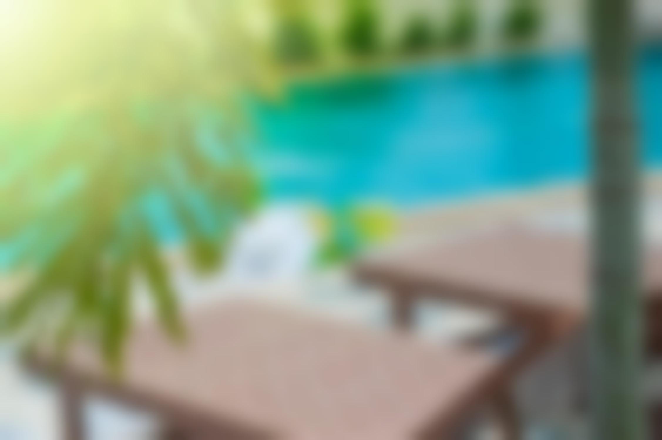 image of chairs sitting poolside