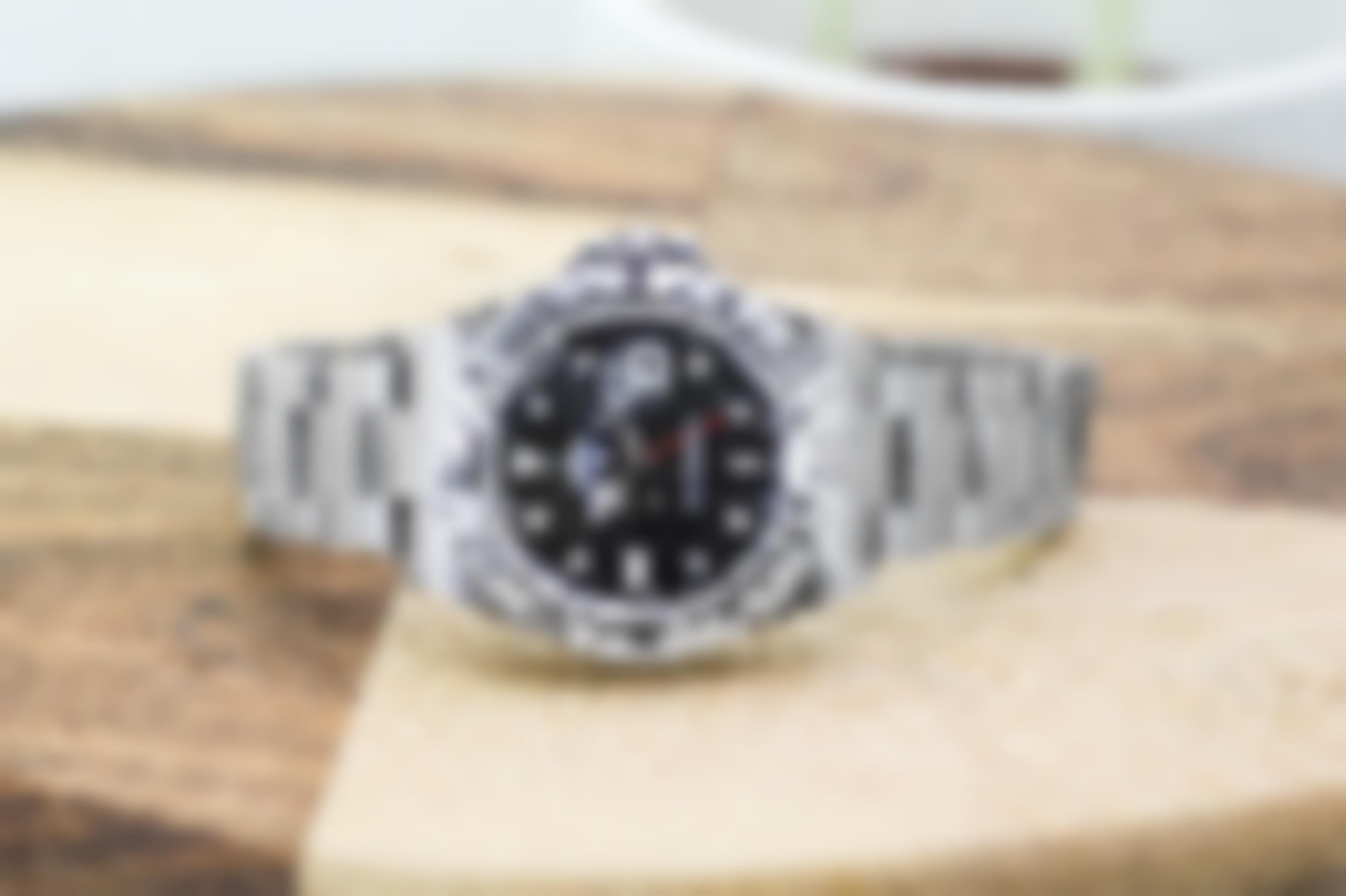 Pre-owned men’s Rolex Explorer II in stainless steel with a black dial.