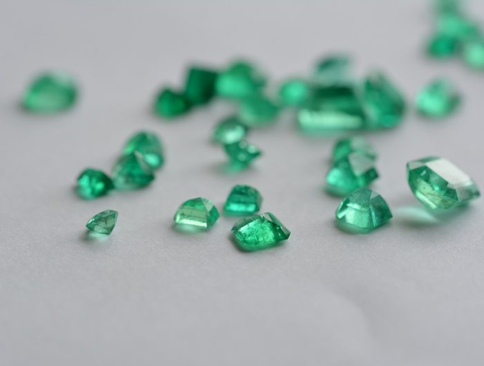 Loose cut emeralds.