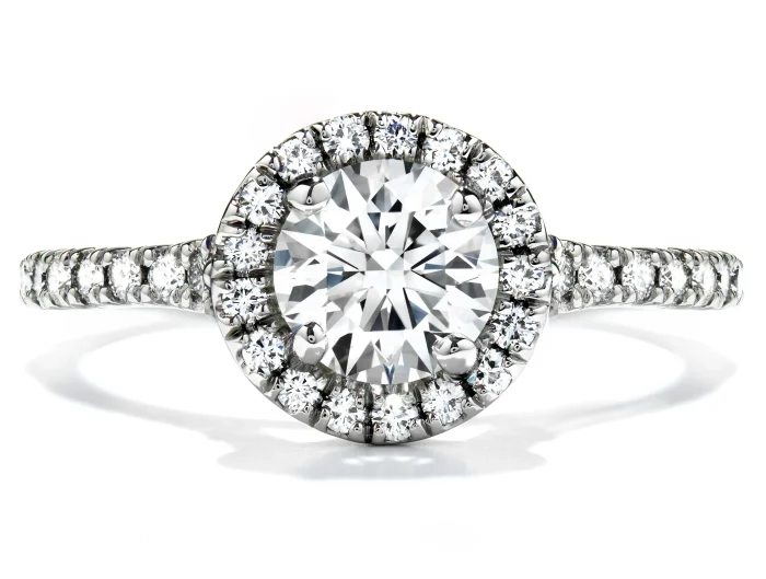 New Hearts On Fire diamond engagement ring with a diamond halo and diamonds in the band.