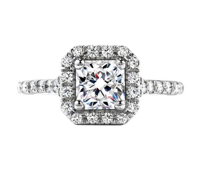 White gold diamond engagement ring with diamond halo and diamonds in the band.