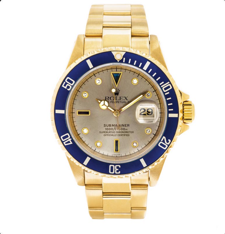 Pre-owned men’s Rolex Submariner in yellow gold with a blue ceramic bezel.