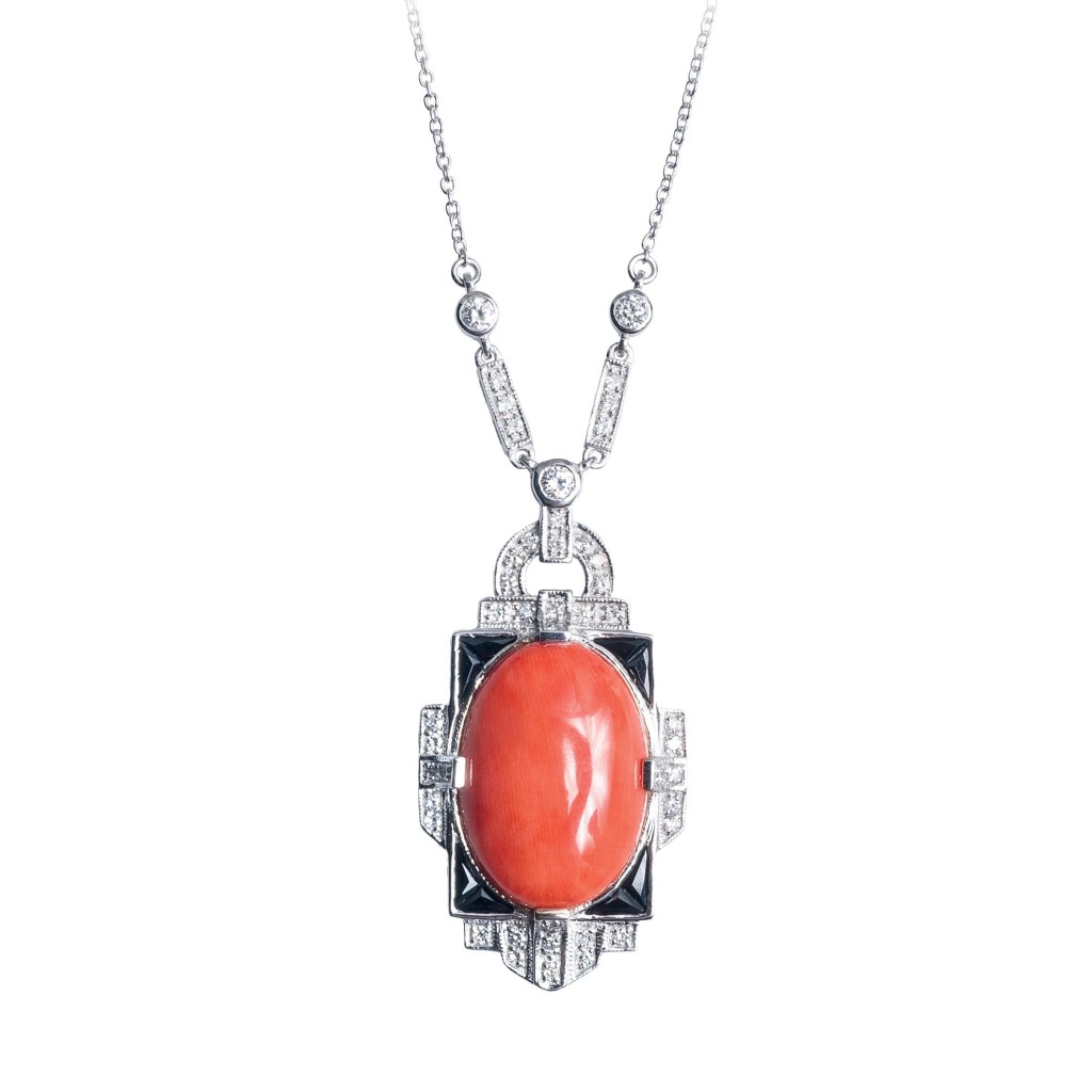 White gold Art Deco pendant set with coral, black onyx, and diamonds.