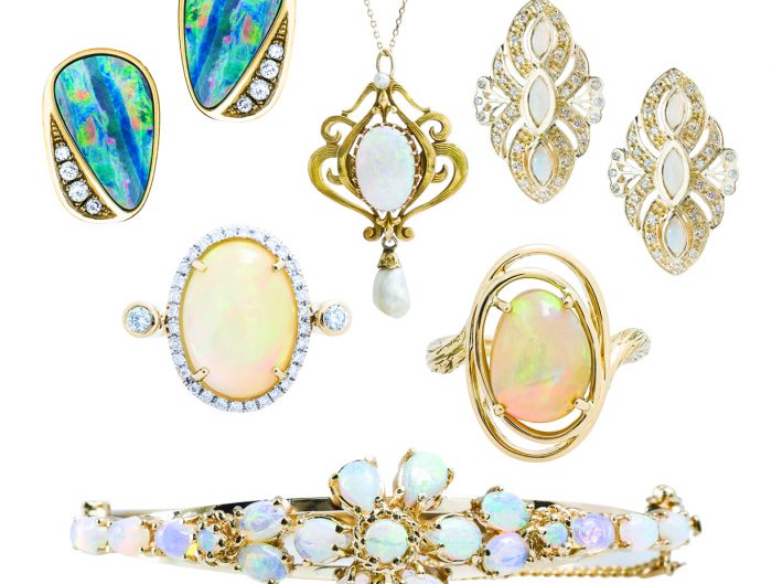 Assorted fine opal jewelry including earrings, rings, a necklace, and a bracelet.