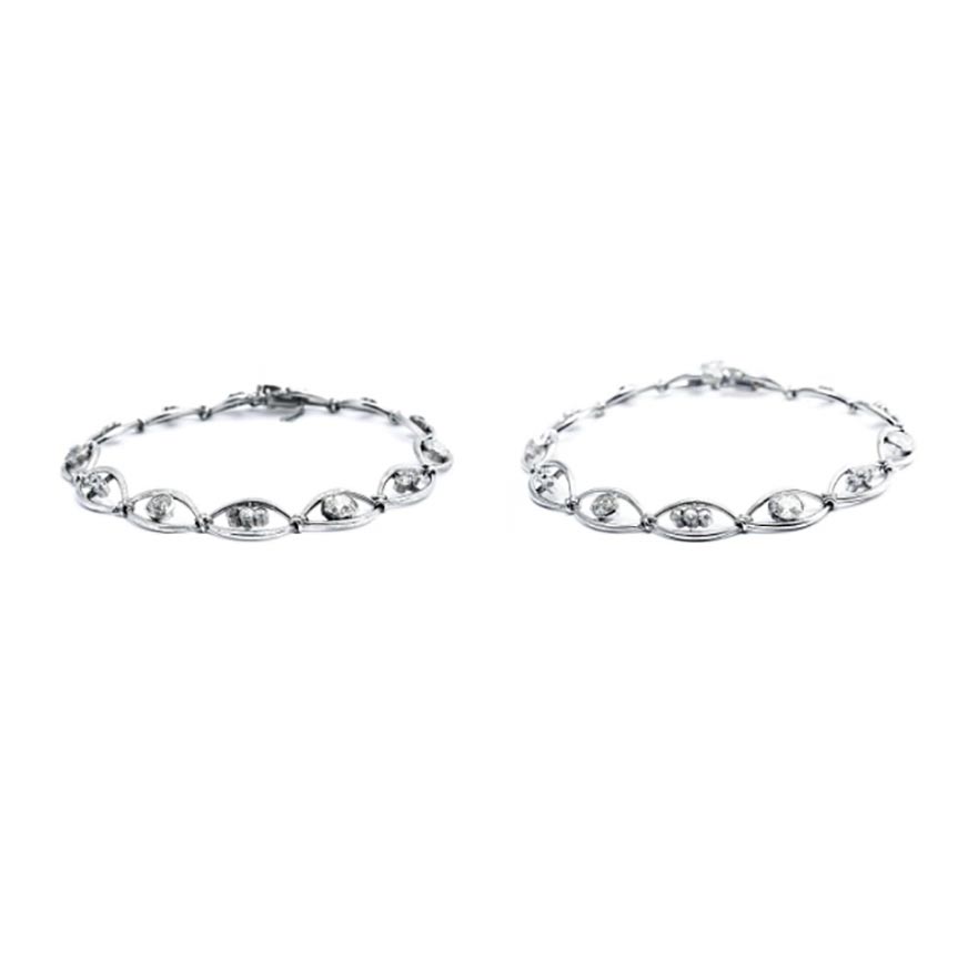 Two white gold diamond bracelets.