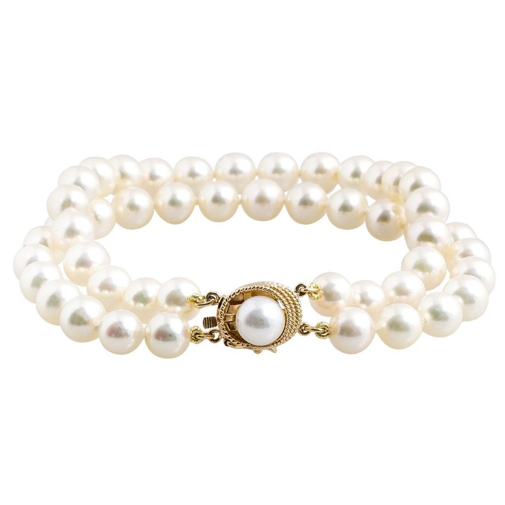 Two-strand yellow gold white pearl bracelet.