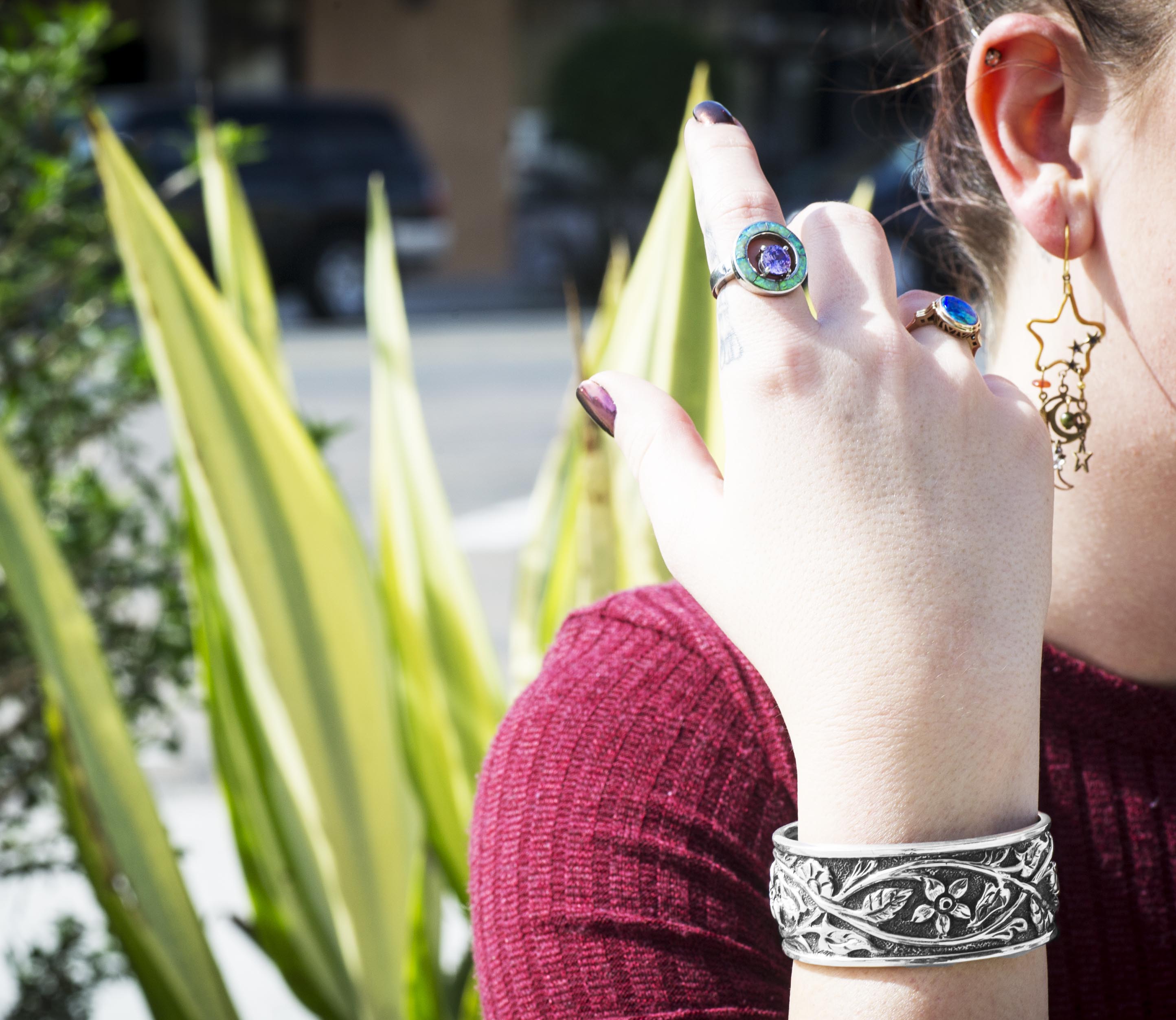 Woman’s arm featuring a sterling silver Native American cuff bracelet and a sterling
silver turquoise Native American ring.