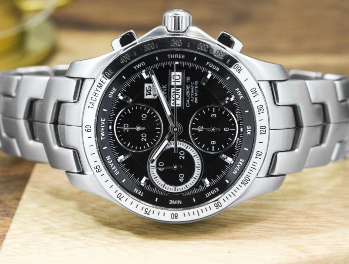 Pre-owned men's TAG Heuer Link in stainless steel with a black dial.