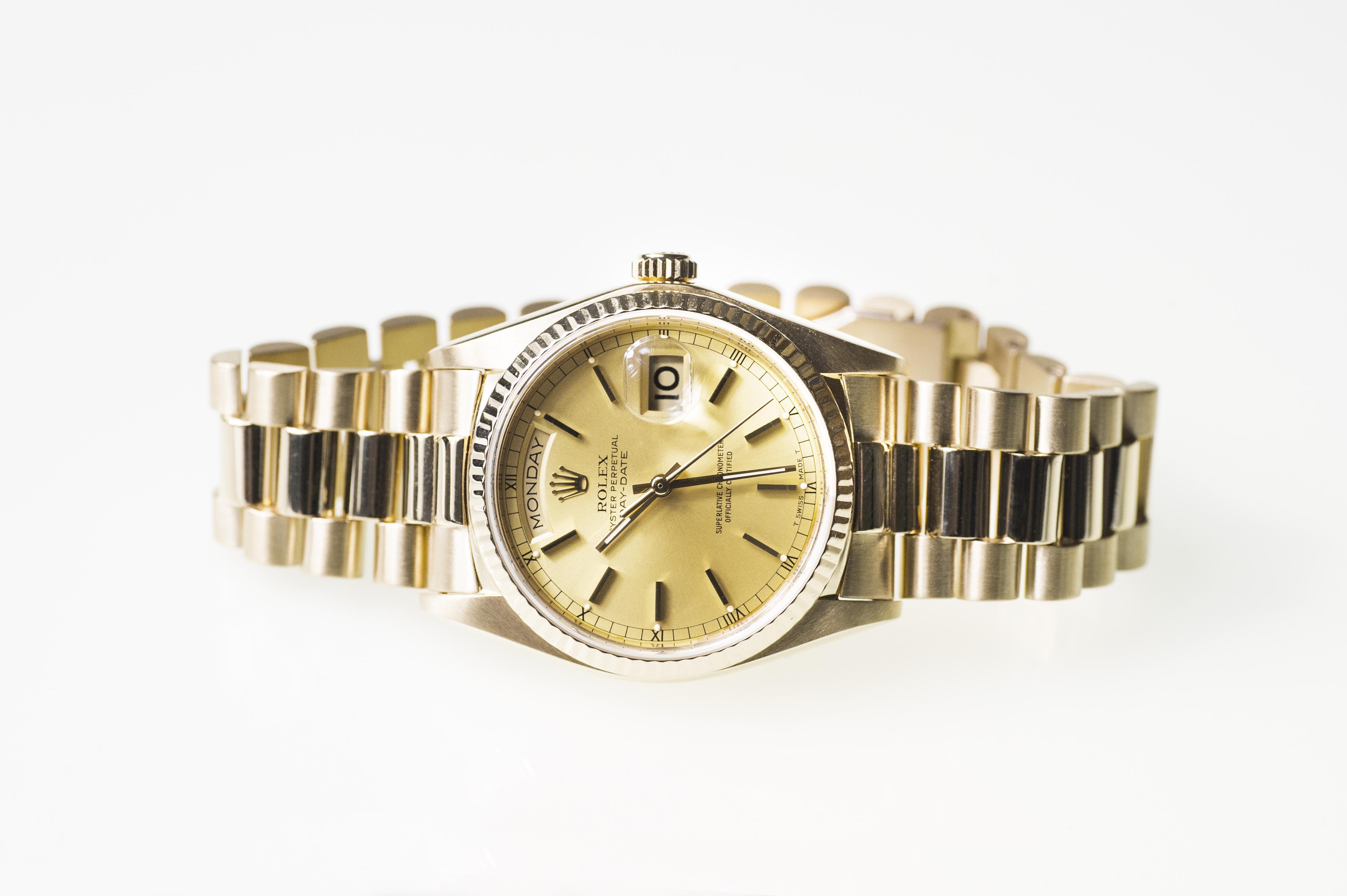 Pre-owned men’s Rolex Day-Date in yellow gold.