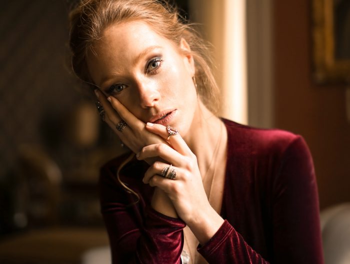 Woman wearing multiple stacking rings.