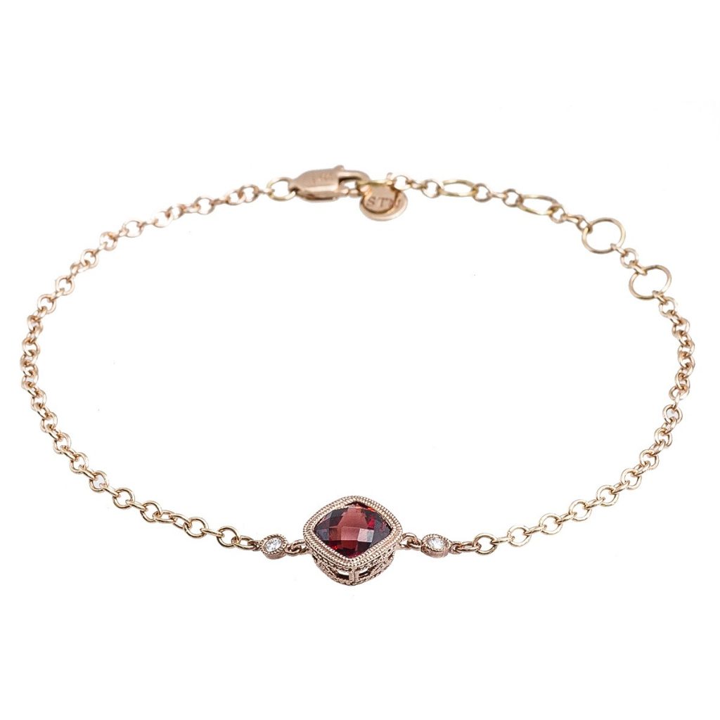 Rose gold bracelet set with garnet and diamonds.