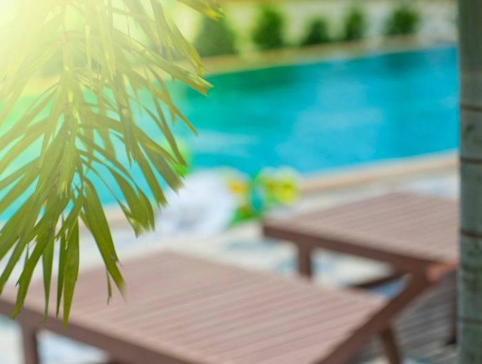 image of chairs sitting poolside