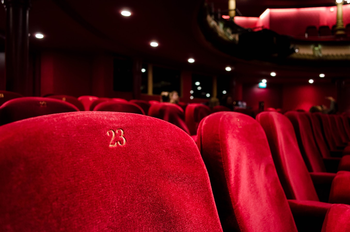 Row of red movie theater seats.