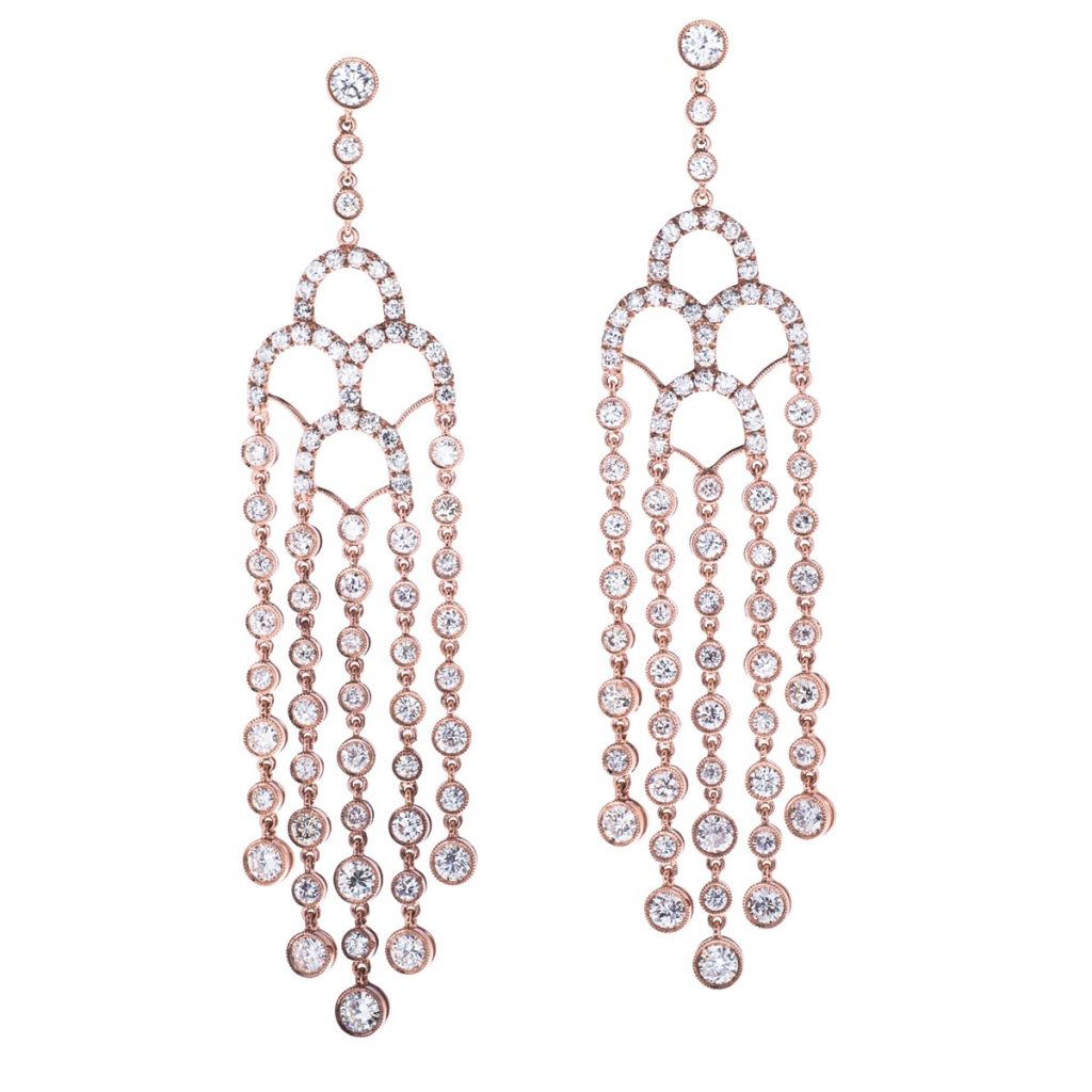 Rose gold chandelier earrings set with diamonds.