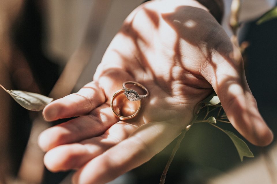 Yellow gold wedding ring and engagement ring set with lab-grown diamonds.