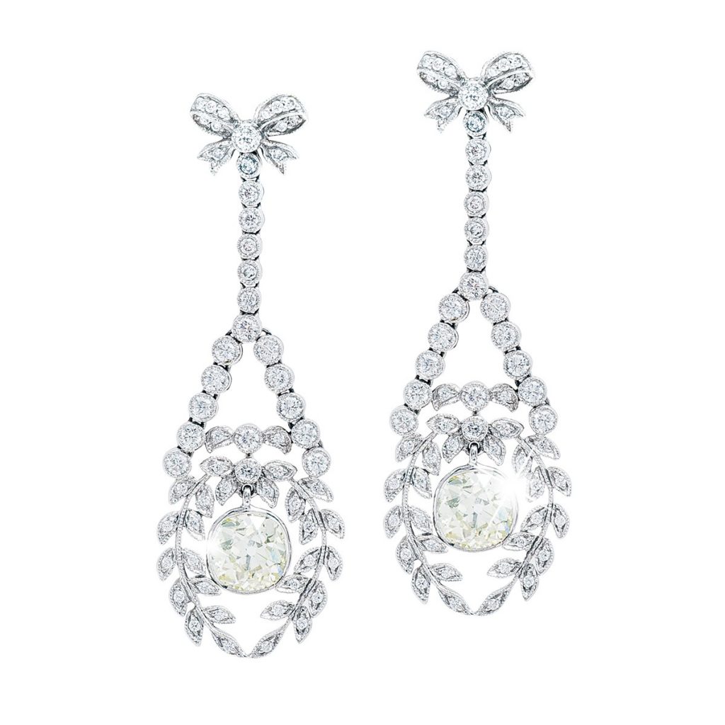 White gold chandelier earrings set with diamonds.