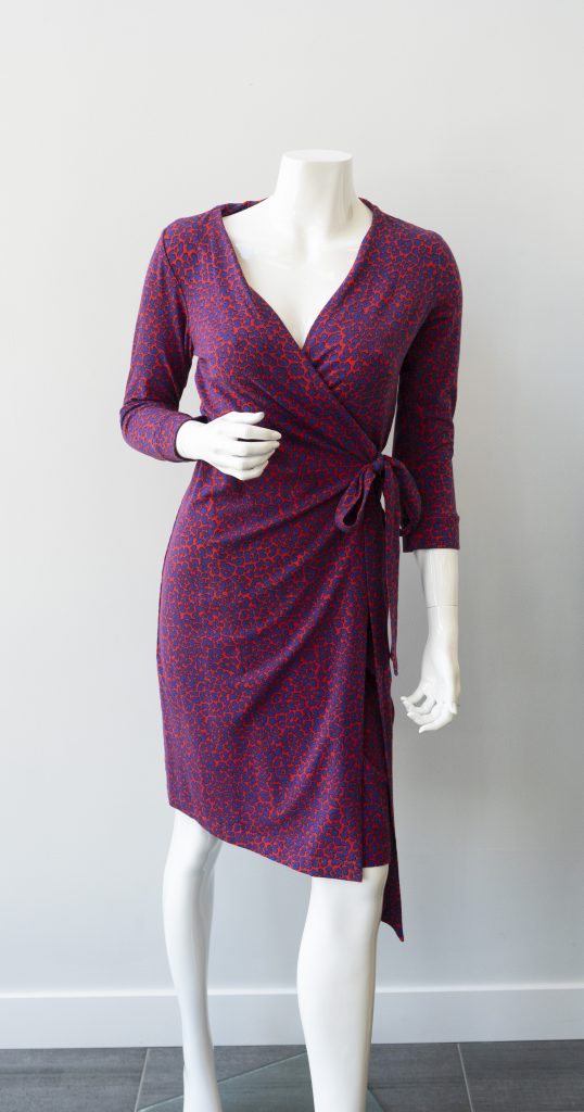 Mannequin with vintage maroon tie-waist dress.