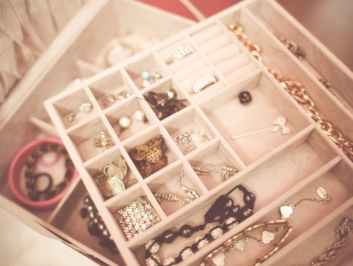 Jewelry storage case filled with various fine jewelry.