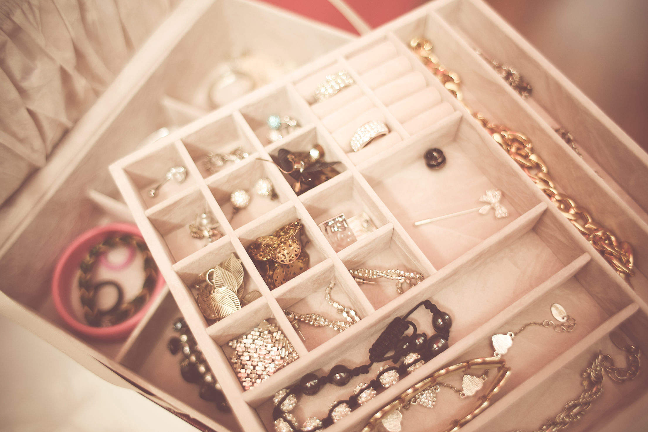 Jewelry storage case filled with various fine jewelry.