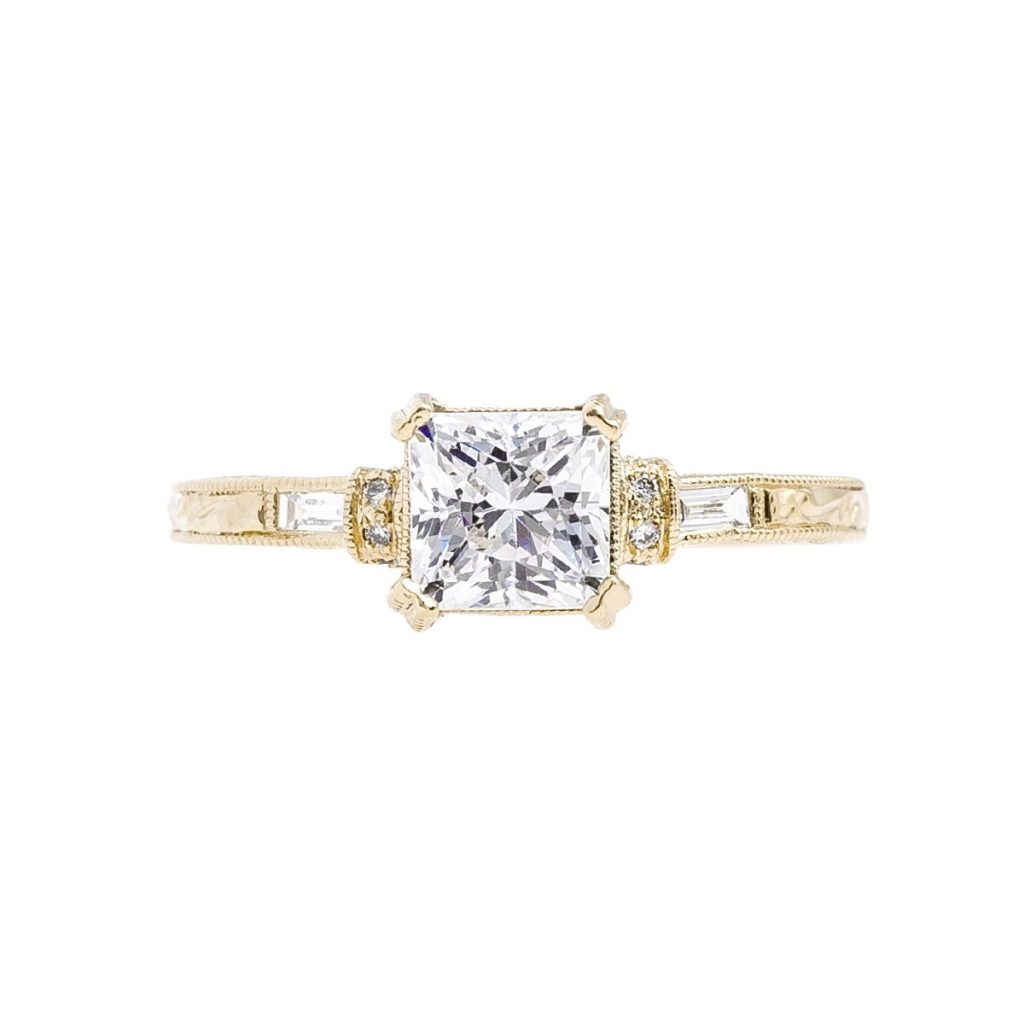 Yellow gold diamond ring with diamonds in the band.