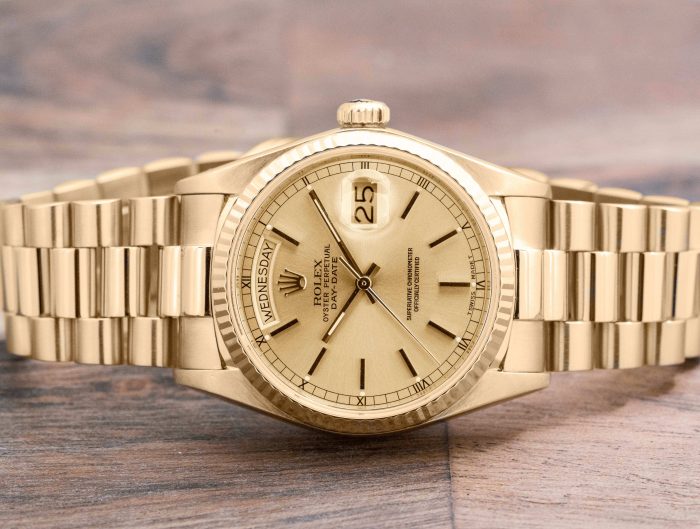 Pre-owned men’s Rolex Day-Date in yellow gold with gold dial.