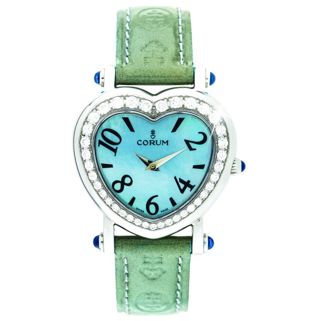 Pre-owned women’s 30mm Corum Heart in stainless steel with a blue dial, green leather
strap, and quartz movement.