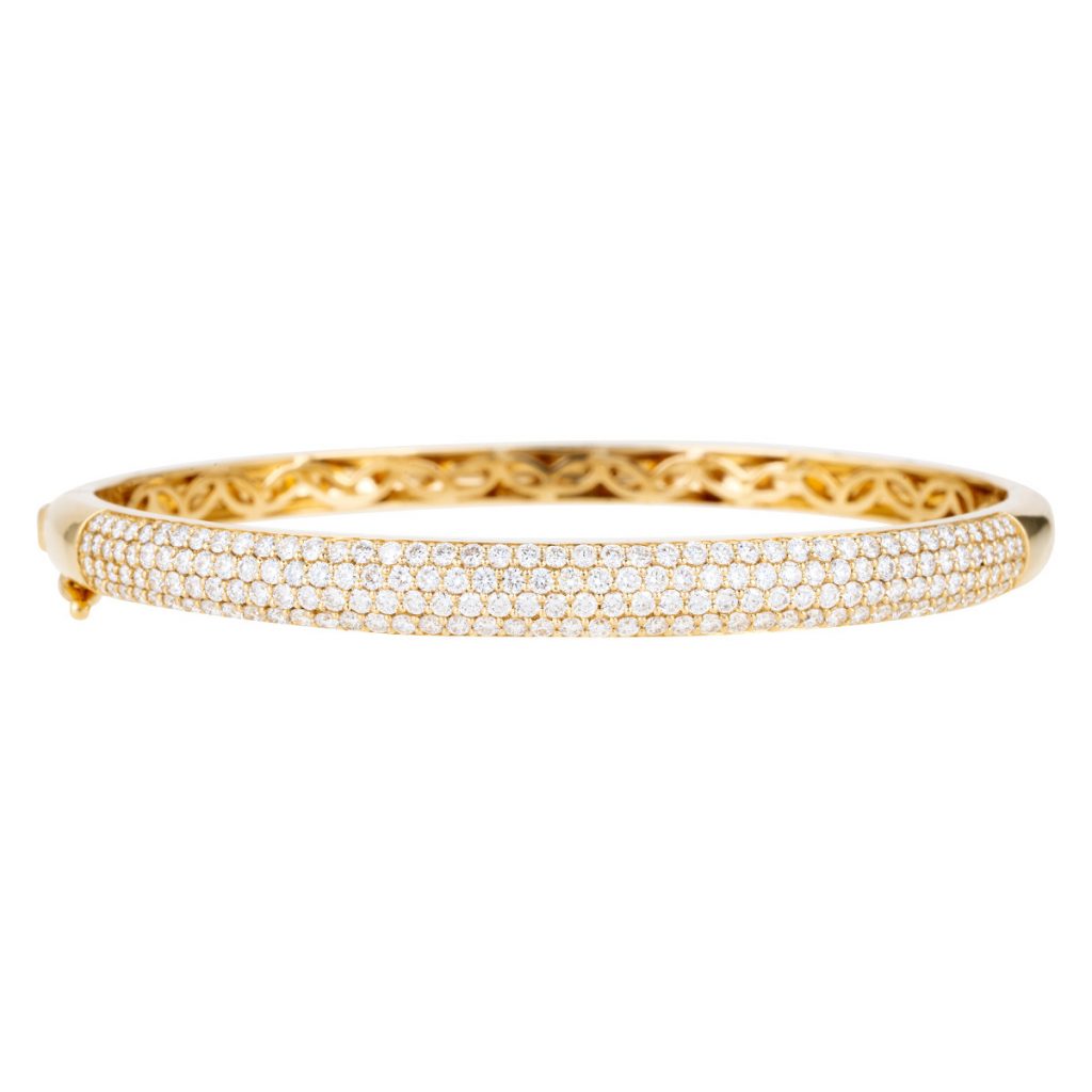 Yellow gold pavé bangle set with diamonds.