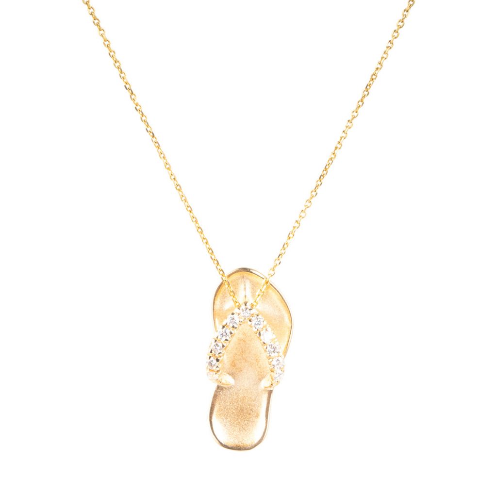 Vintage yellow gold Na Hoku sandal pendant set with diamonds.