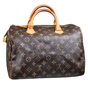 Vintage canvas Louis Vuitton Monogram Speedy 30 handbag.