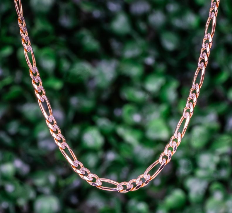 Yellow gold figaro chain.