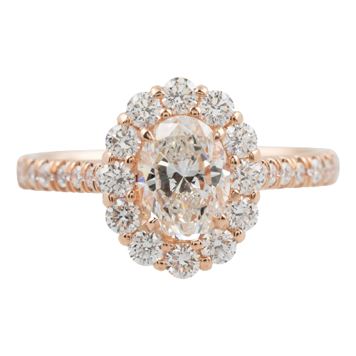 Rose gold diamond engagement ring with a diamond halo.