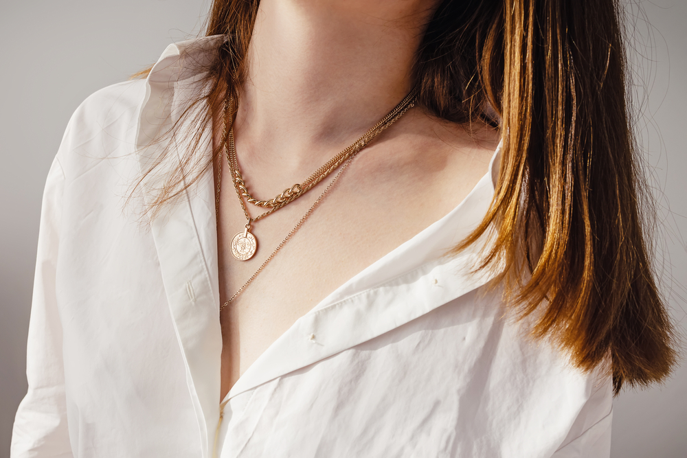 woman featuring multiple layered neckalces