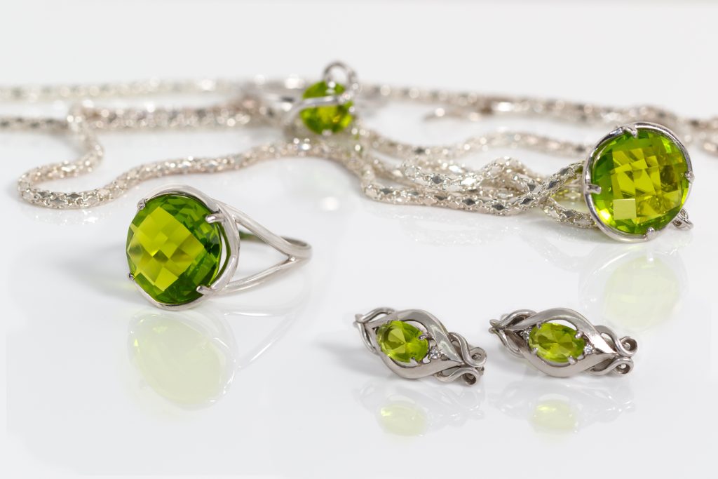 peridot necklace, ring, and earrings