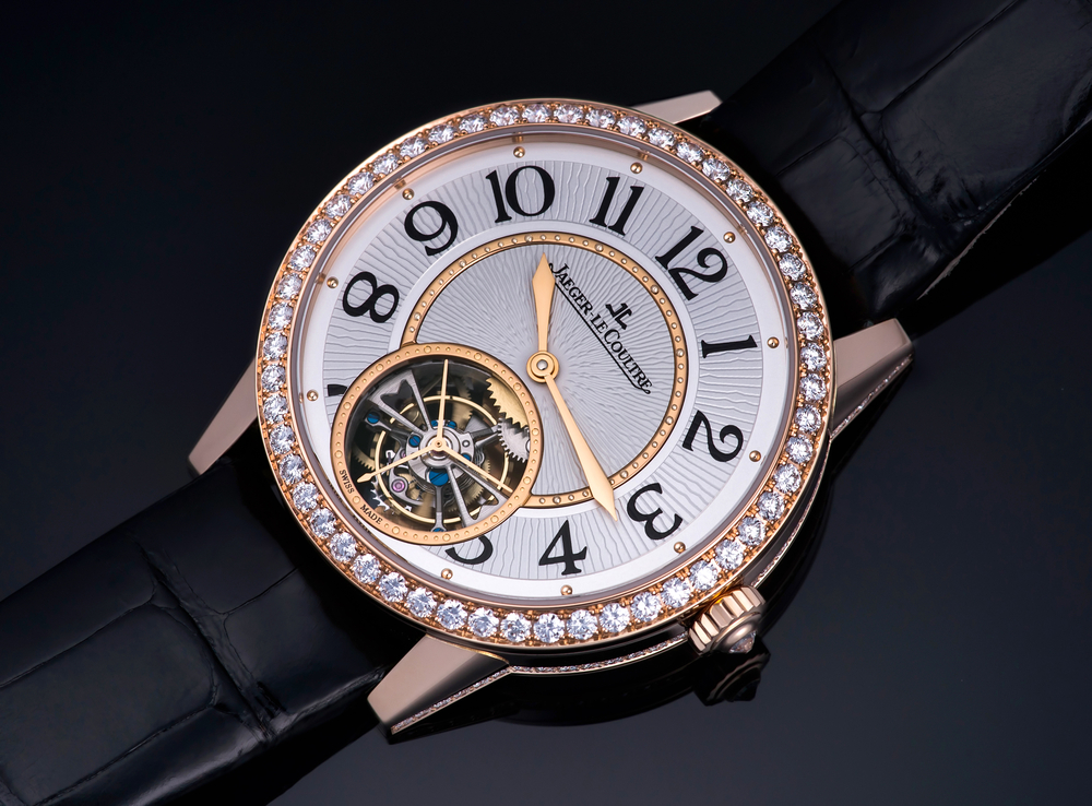 Jaeger-LeCoultre watch with a diamond bezel and leather strap