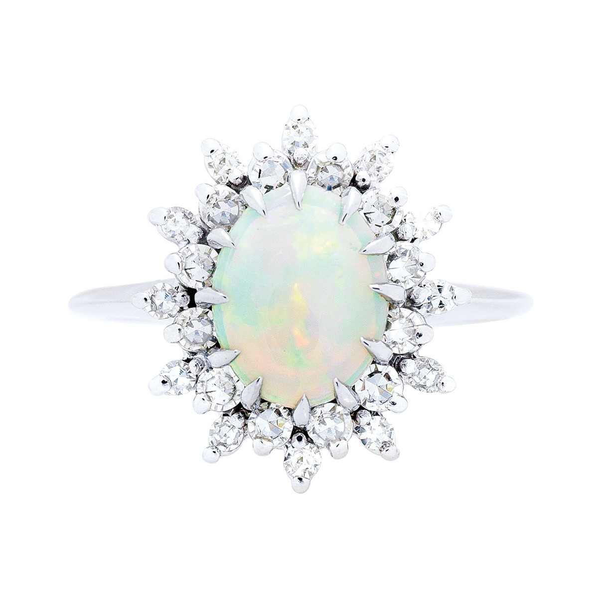 an Ethiopian opal white gold ring surrounded by a diamond halo