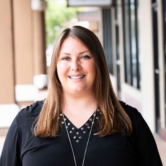 professional headshot of a woman with a plaza in the background