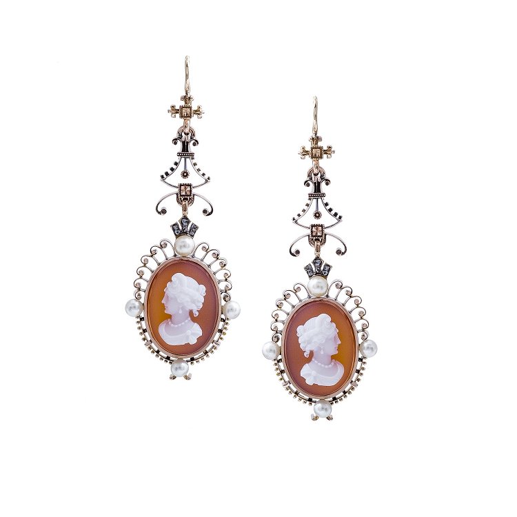 Vintage-style cameo earrings with intricate gold detailing, featuring pearl accents and a carved profile on each piece.