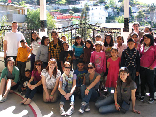 a large group of kids posing together for a photo