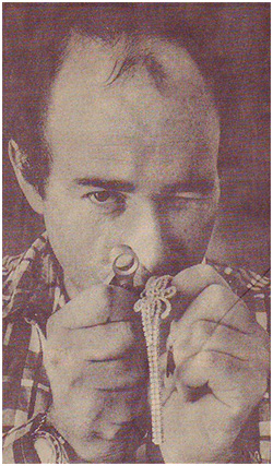 retro photograph of a jeweler inspecting a piece with a loupe