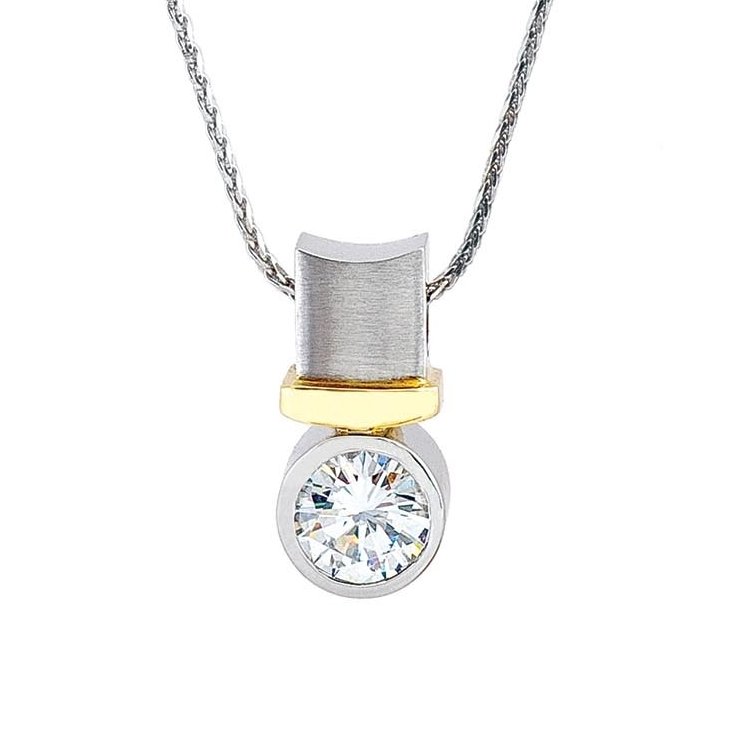  a solitaire diamond pendant set in platinum and yellow gold