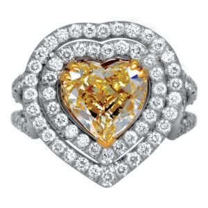 platinum double halo engagement ring with a yellow heart shaped diamond