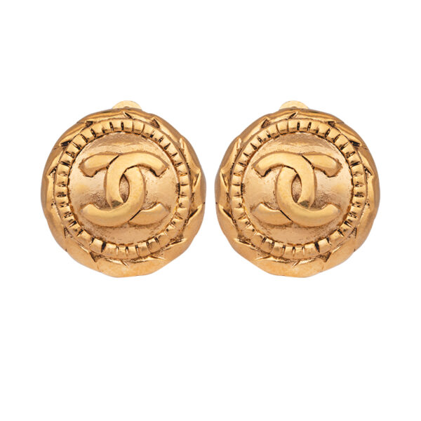 gold tone chanel clip on earrigns, round with the chanel logo on the front