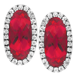 white gold oval ruby and diamond halo earrings on a white background