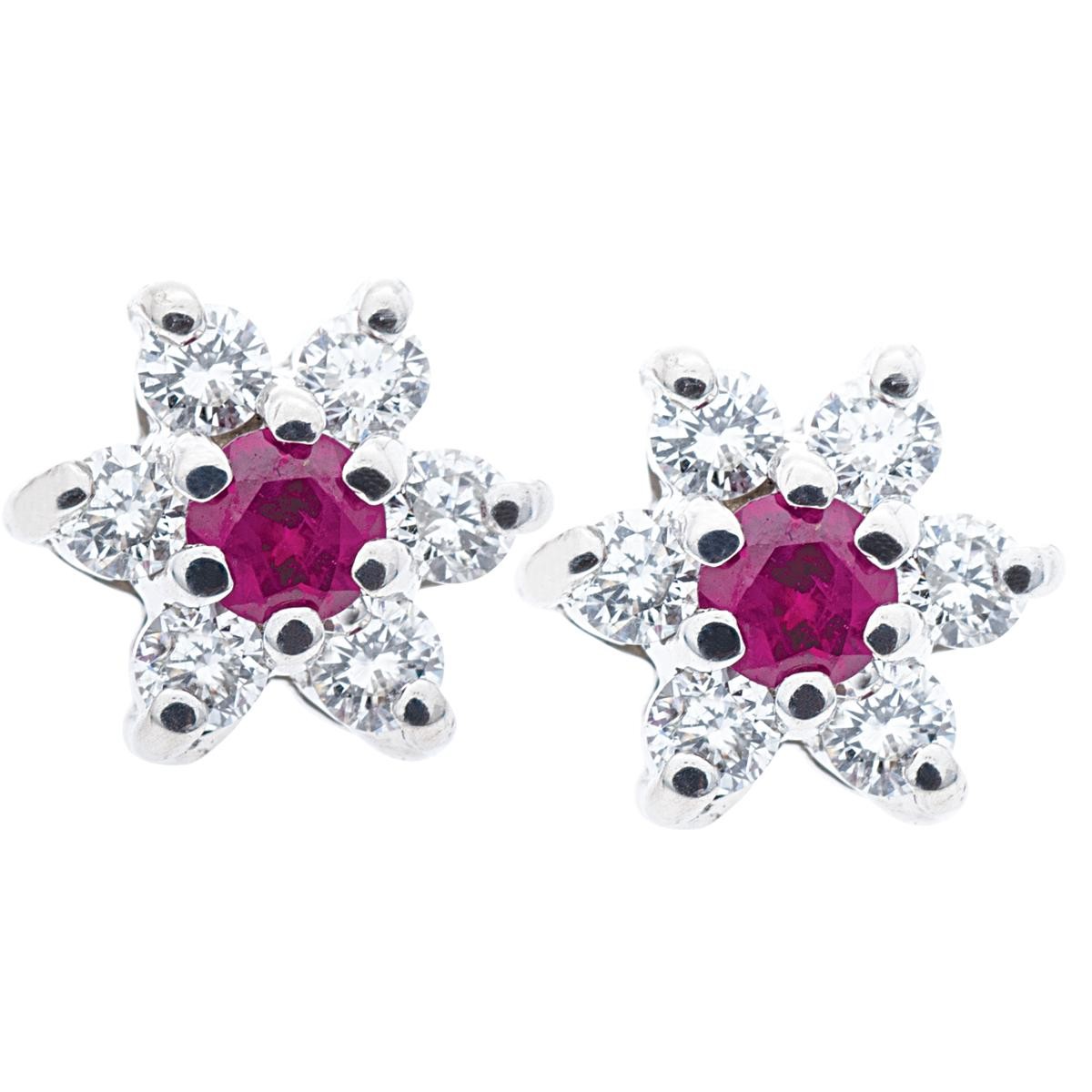 White gold flower stud earrings centered with rubies and diamond petals.