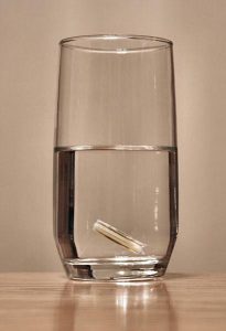 Wedding ring in a glass of water.