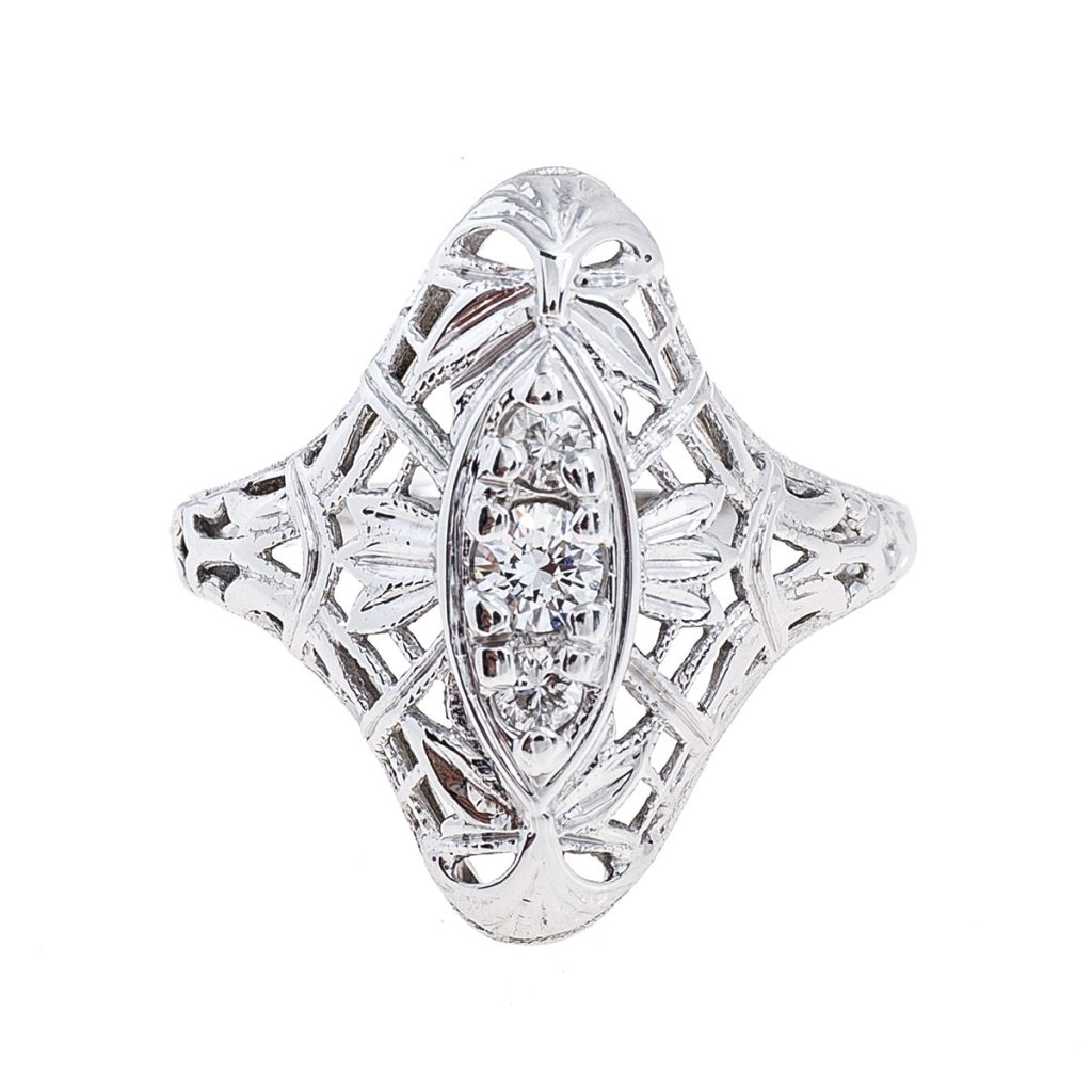 Platinum Edwardian elongated filigree ring set with diamonds.