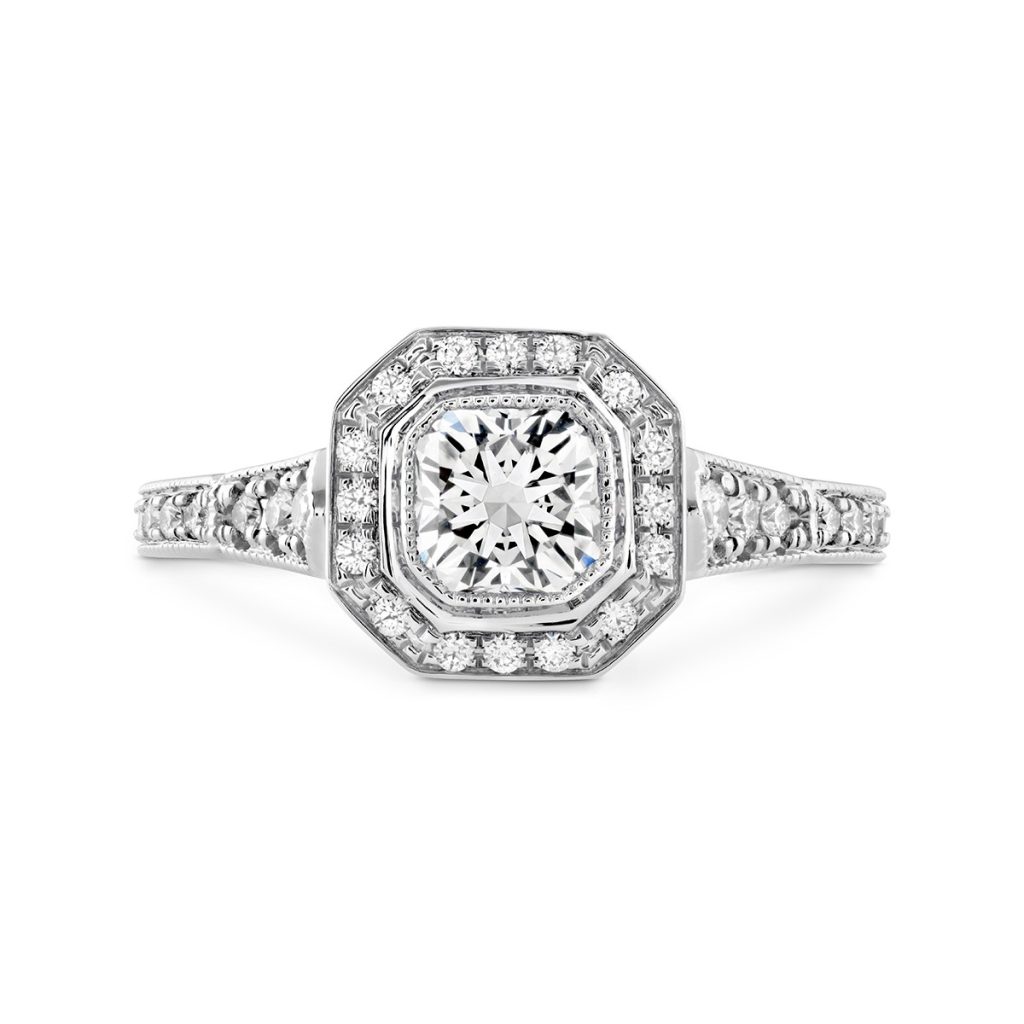 White gold diamond engagement ring with diamond halo and diamonds in the band.