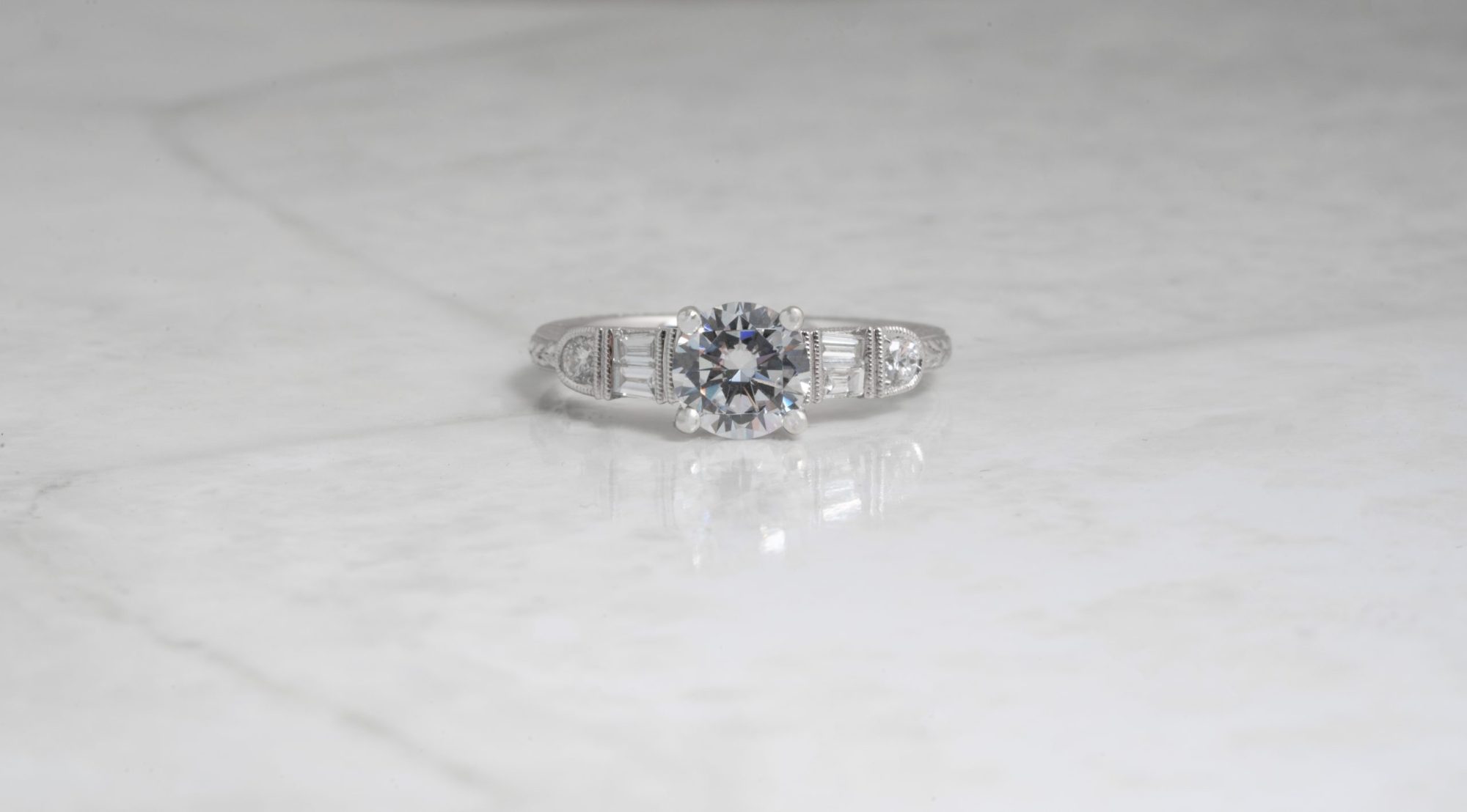 White gold five-stone diamond engagement ring.