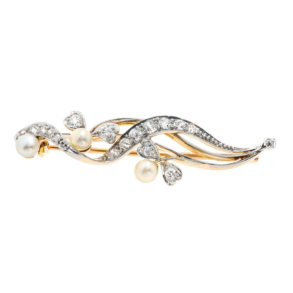 Yellow gold diamond and pearl bangle.